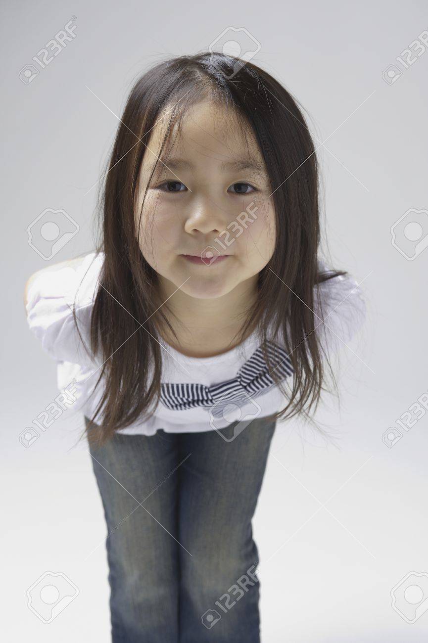 Girl Of 6 Year Old Stare And Bend Over Camera Stock Photo Picture And Royalty Free Image Image