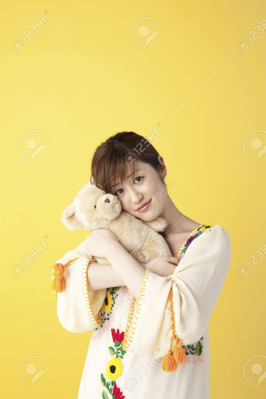 holding a stuffed animal