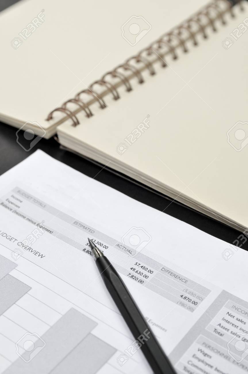balance sheet blank notepad and pencil on the table on the stock