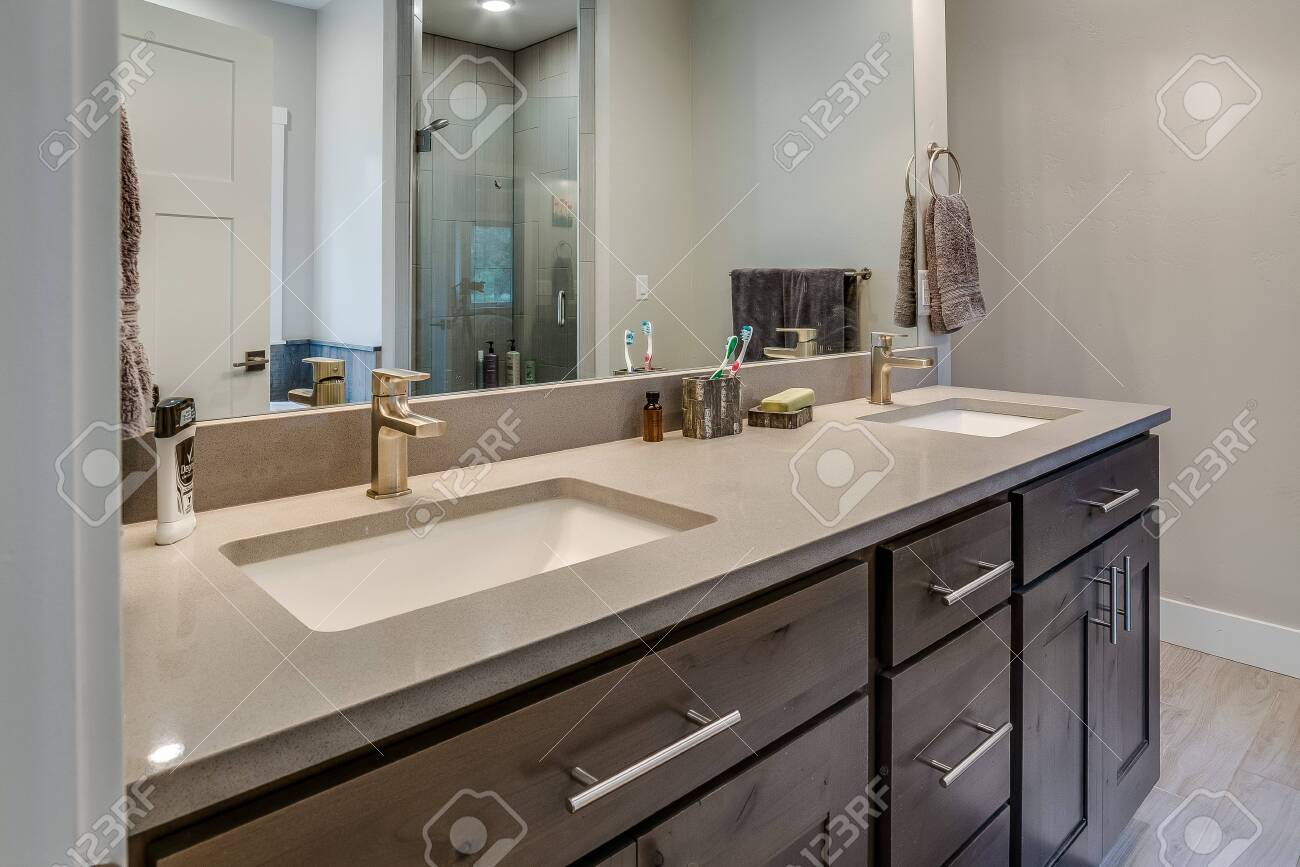 Solid Surface Countertops And Double Sinks In This Beautiful Stock Photo