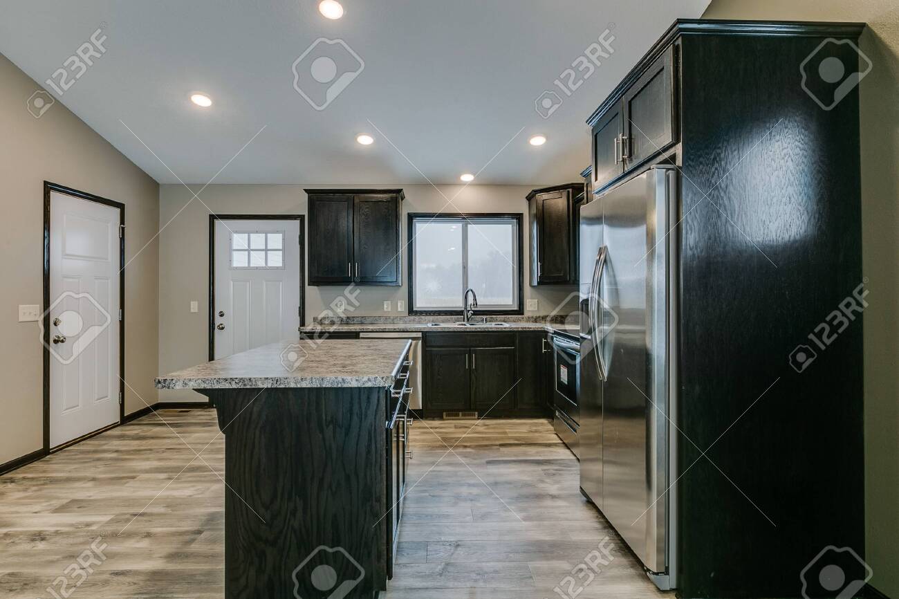 Front Door Opens Right Next To Kitchen With Open Layout Stock Photo,  Picture and Royalty Free Image. Image 147490859., image size:1300x866