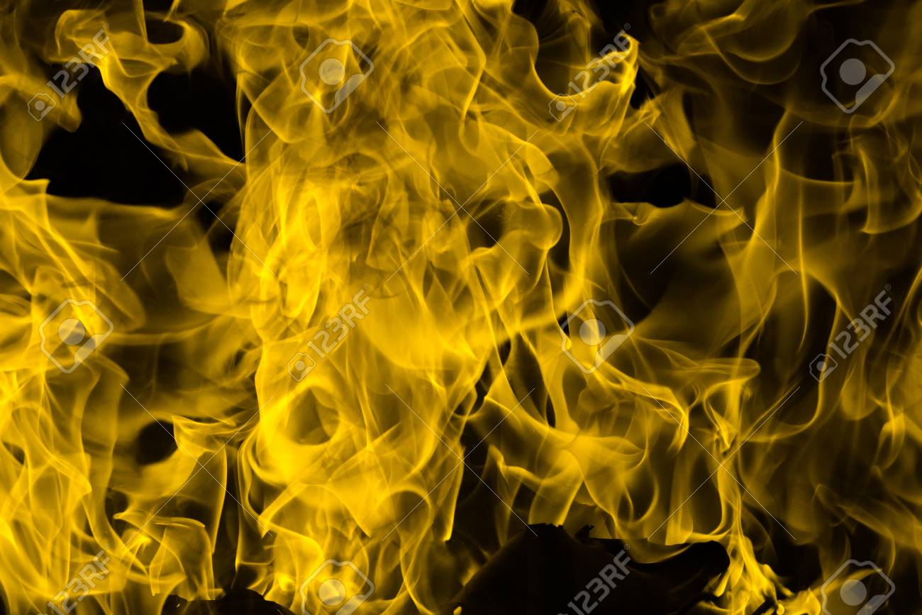 Yellow Fire Flame Background And Textured Stock Photo, Picture and Royalty  Free Image. Image 76916562.