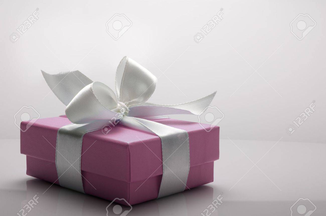 small pink box tied with a white ribbon - 12287950 small pink box tied with a white ribbon - 12287950