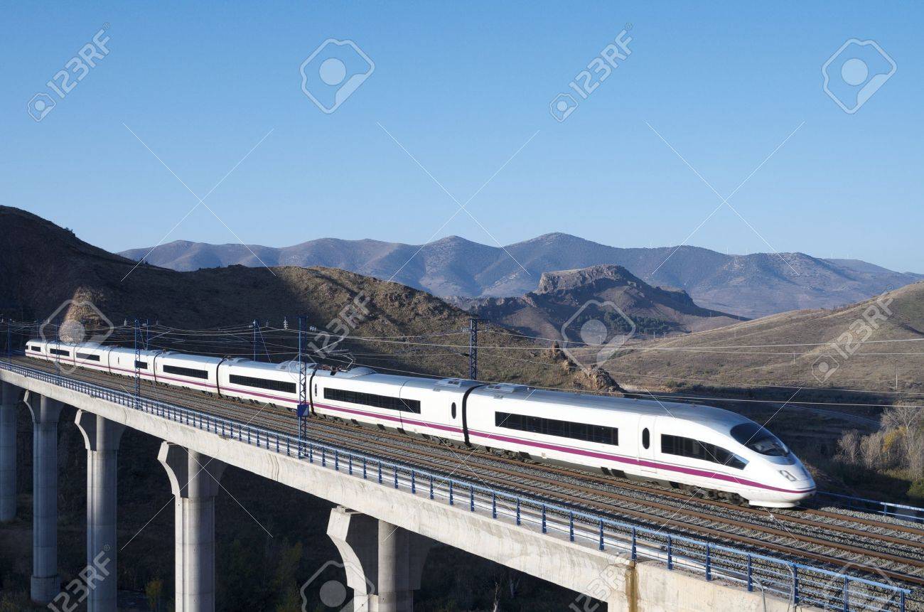 view of a high-speed train crossing a viaduct in Purroy, Saragossa, Aragon, Spain; AVE Madrid Barcelona - 12680499 view of a high-speed train crossing a viaduct in Purroy, Saragossa, Aragon, Spain; AVE Madrid Barcelona - 12680499