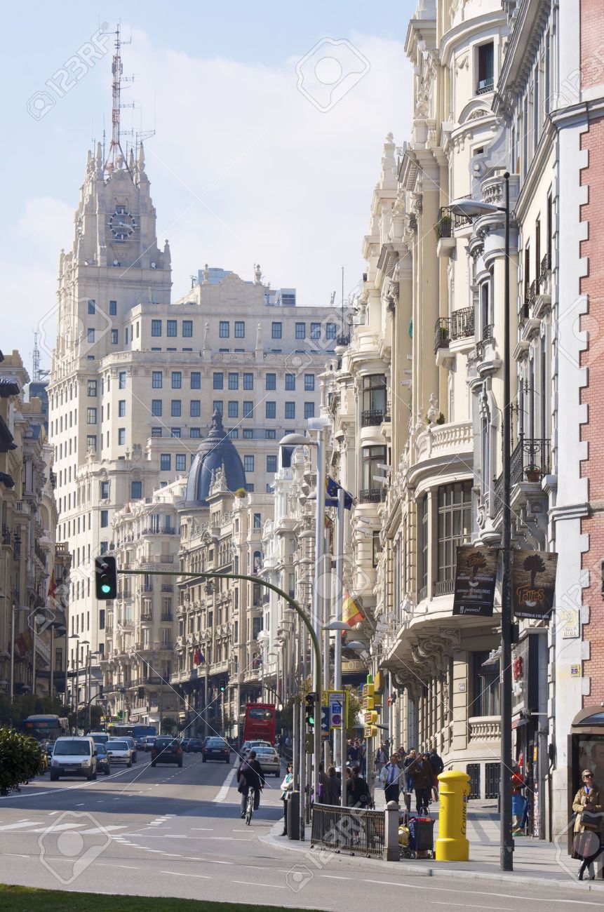 Madrid, Spain - February 22, 2012: A view of the street known as Gran Via, one of the busiest streets of the city and traveled daily by thousands of tourists - 12992946 Madrid, Spain - February 22, 2012: A view of the street known as Gran Via, one of the busiest streets of the city and traveled daily by thousands of tourists - 12992946
