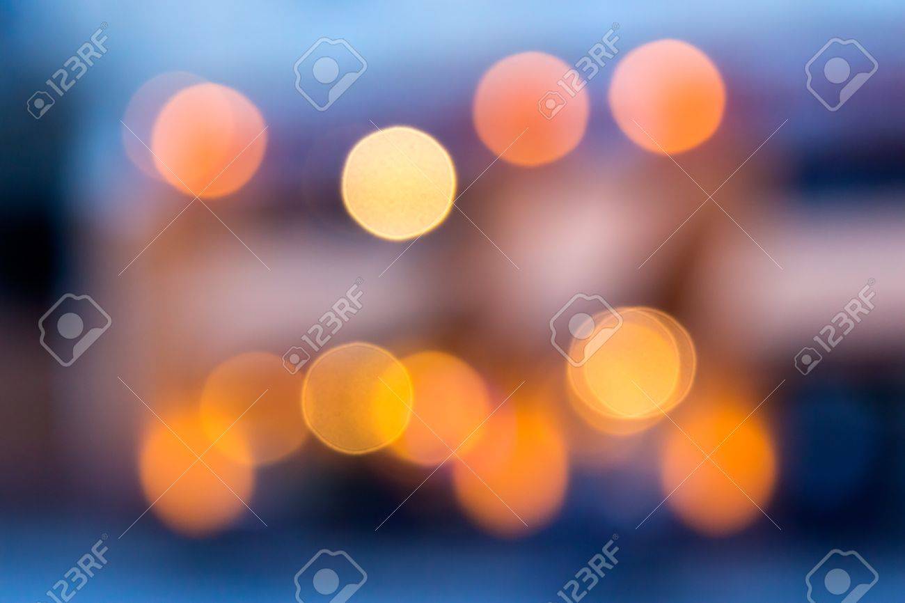 Abstract Background Of Blurred Warm Lights With Cool Blue And