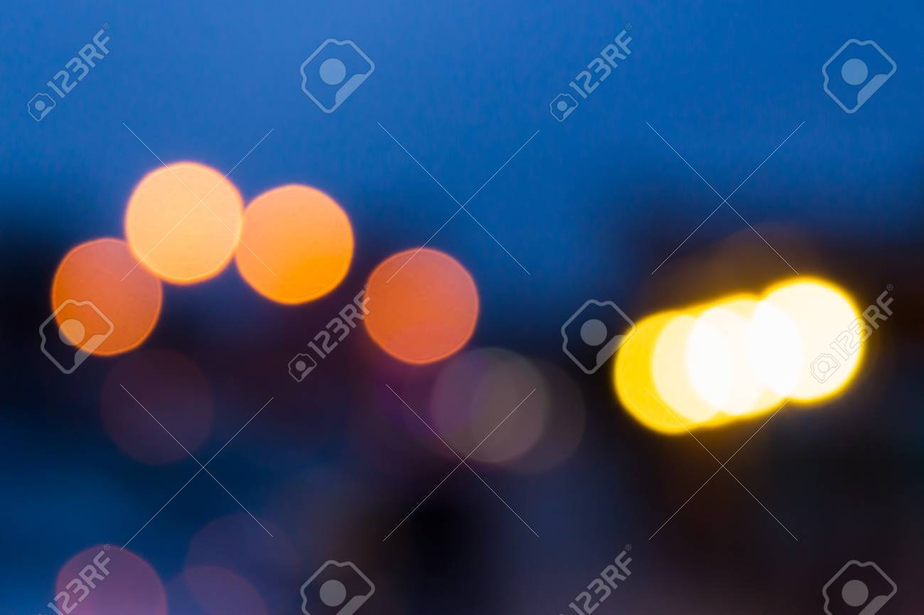 Abstract Background Of Blurred Warm Lights With Cool Blue And