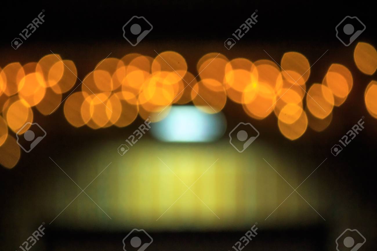 Abstract Background Of Blurred Warm Lights With Cool Blue And