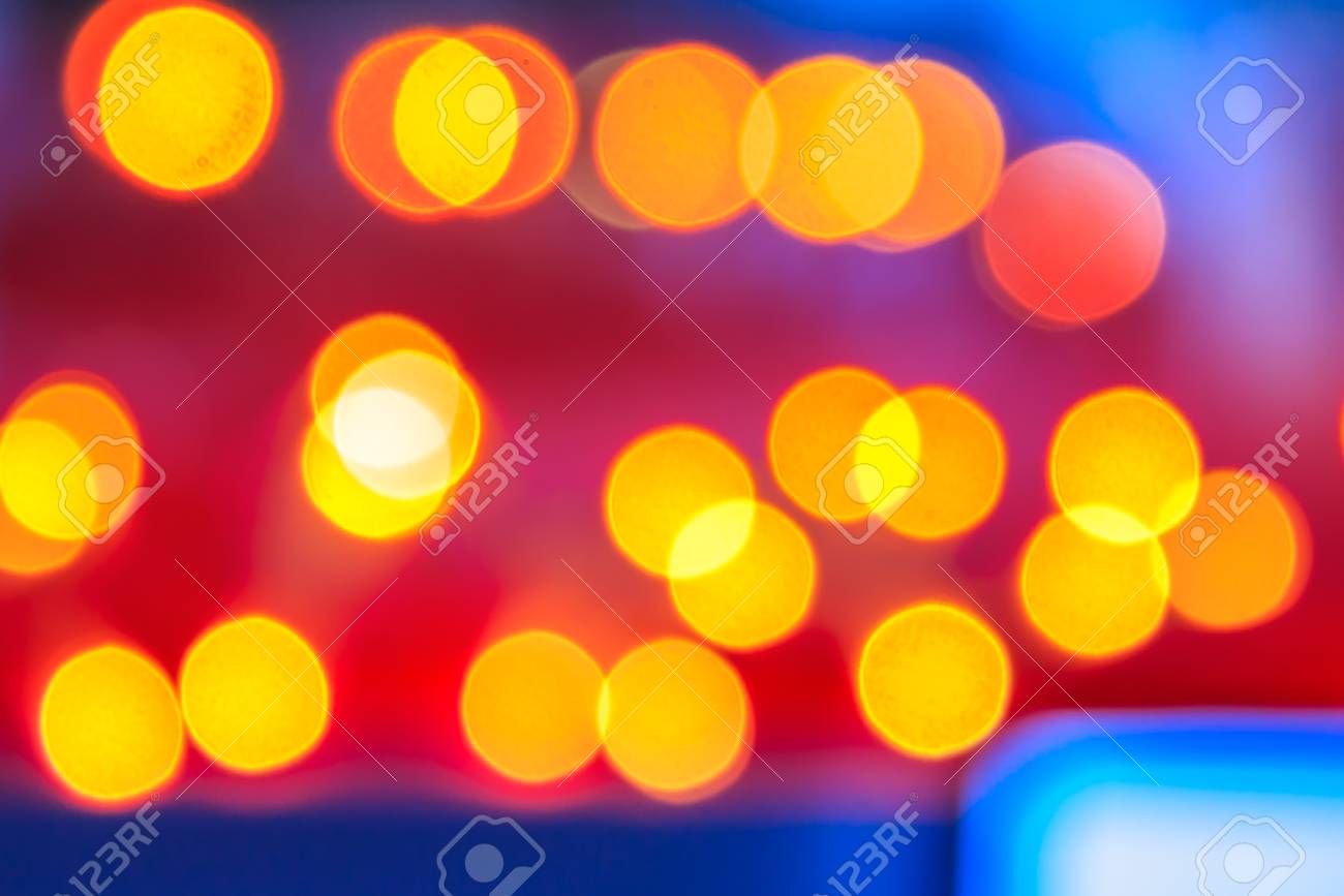 Abstract Background Of Blurred Warm Lights With Cool Blue And