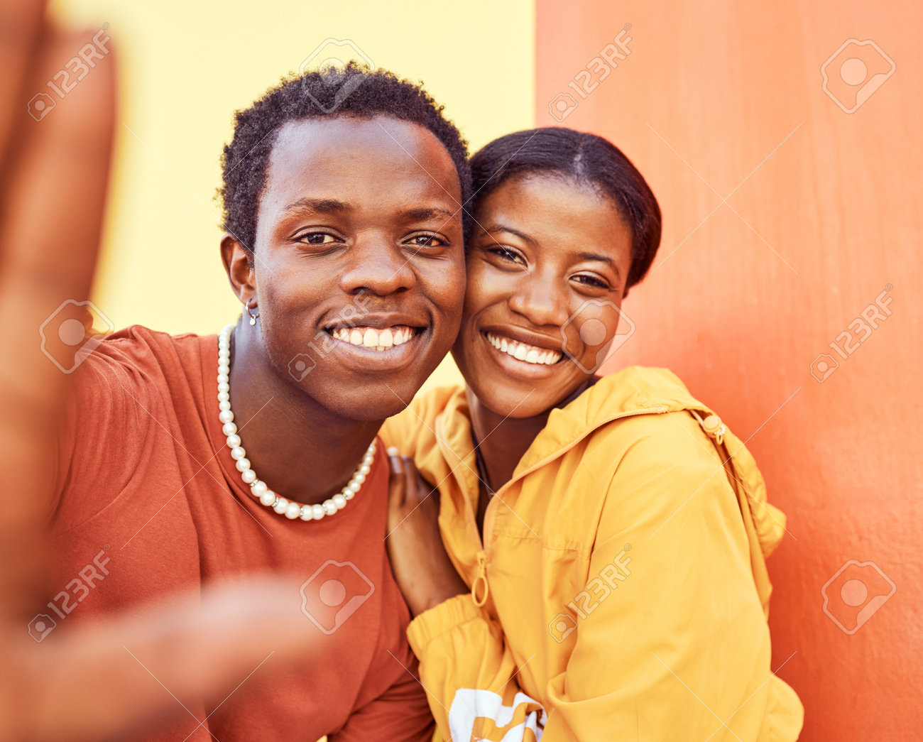 Selfie, love and memories with a black couple posing for a photograph  together on a color wall background. Portrait, happy and smile with a man  and woman taking a picture while bonding, image size:1300x1045