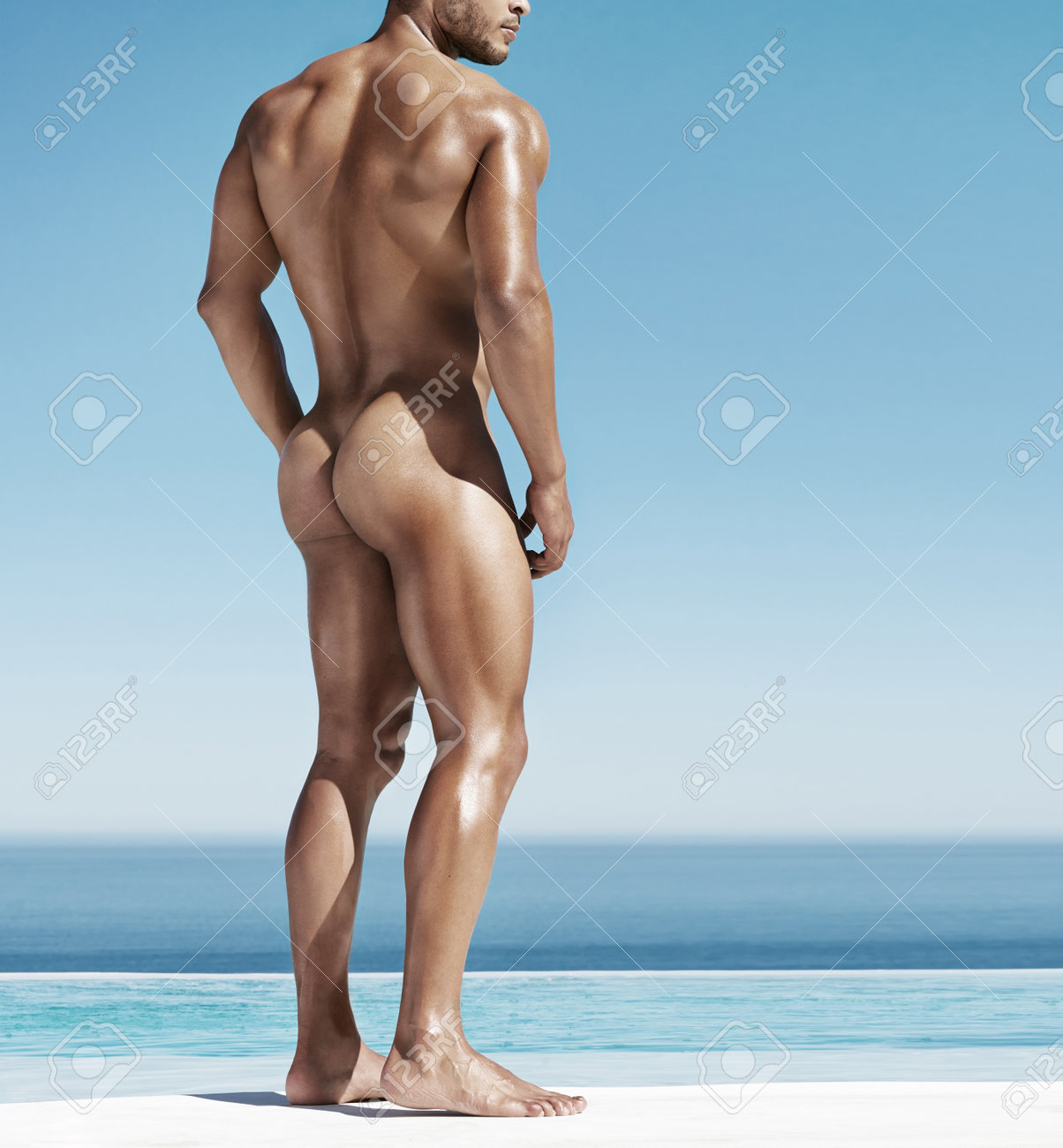 Beach, Sensual And Naked Muscular Man Standing Outdoor For A Sun Tan While On A Holiday In Hawaii picture