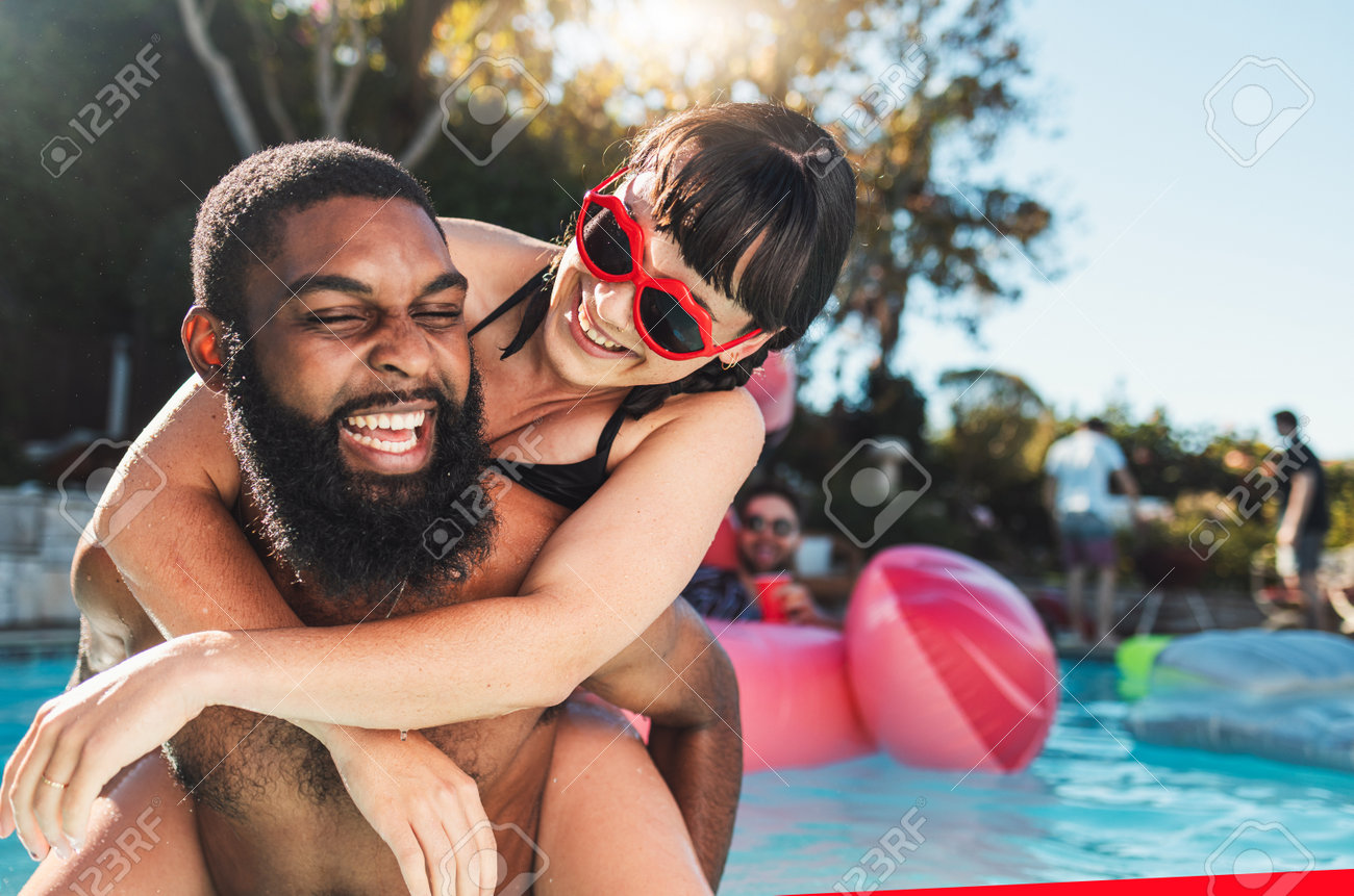 Pool Party, Love And Couple Piggyback, Having Fun Or Bonding. Swimming,  Romance Diversity And Happy Black Man Carrying Woman In Water And Laughing  At Comic Joke Or Meme At Summer Event Or