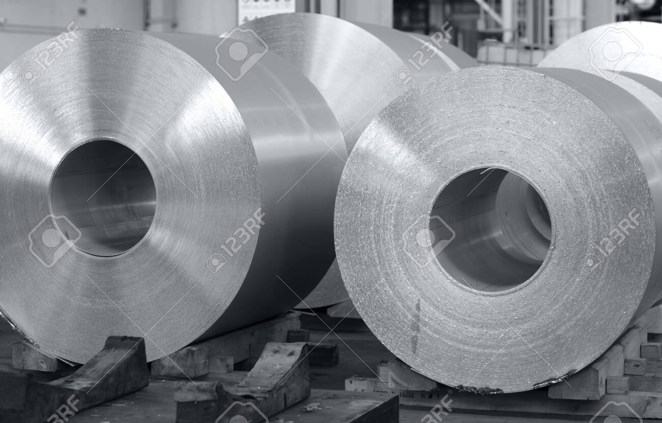 aluminum coils stored waiting for the process just after continuous caster machine. Black and white photo for cover magazine - 123523495 aluminum coils stored waiting for the process just after continuous caster machine. Black and white photo for cover magazine - 123523495