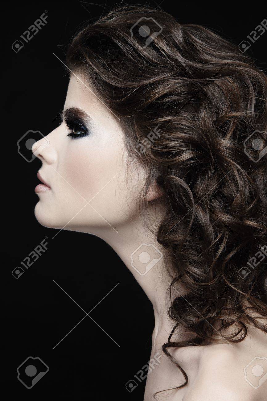 Portrait of a beautiful woman with long curly hairs Portrait of a beautiful woman with long curly hairs