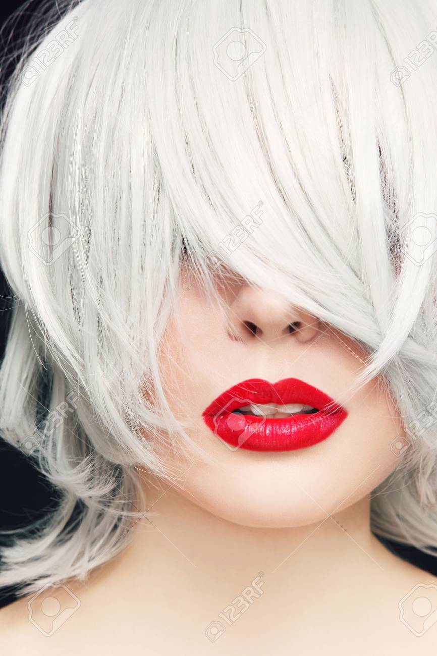 Close,up portrait of young woman with red lipstick and manga..