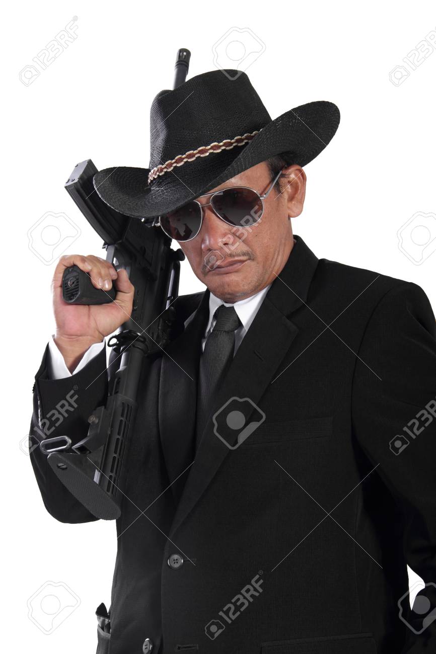 portrait of old gangster holding a gun isolated on white background