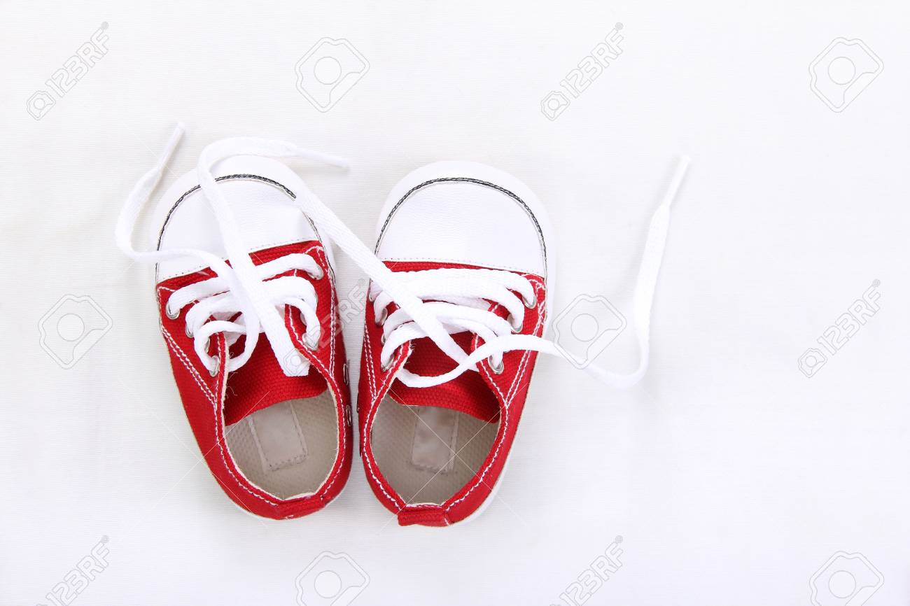 red and white canvas shoes