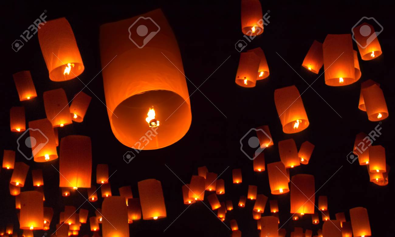 Floating lanterns over the night sky background - 107928964 Floating lanterns over the night sky background - 107928964