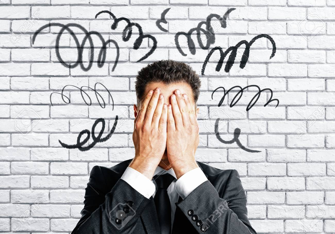 Worried Businessman Covering Face On White Brick Wall Background Stock Photo Picture And Royalty Free Image Image 91104087
