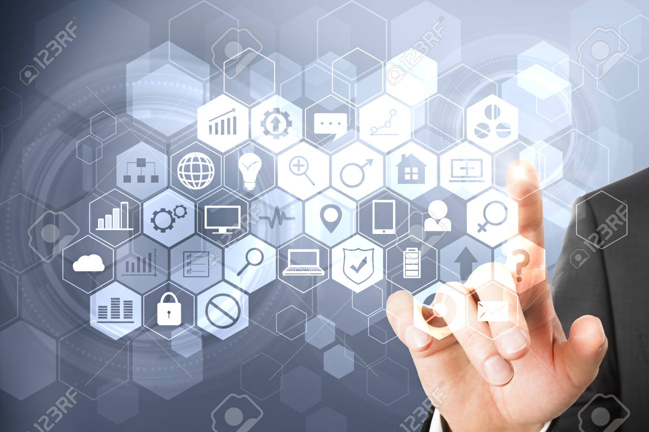 Hand pointing at digital business interface on blurry background. Technology, communication and network concept - 102468164 Hand pointing at digital business interface on blurry background. Technology, communication and network concept - 102468164