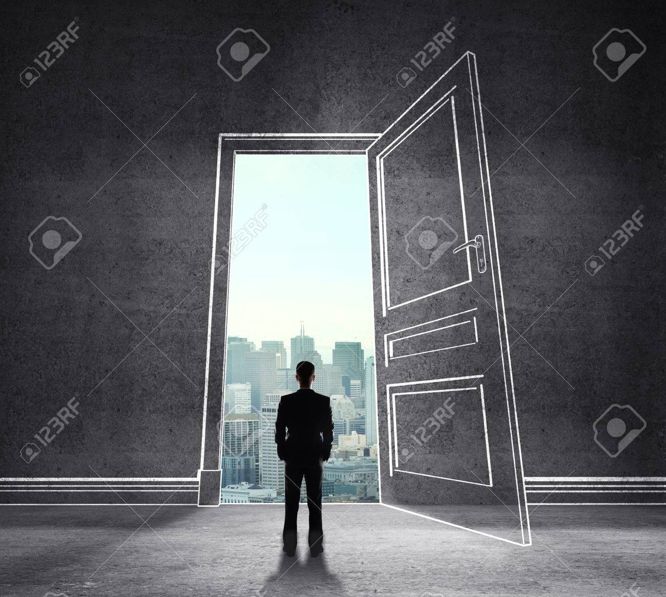 Businessman In Drawing Room With Big Door To City Stock Photo Picture And Royalty Free Image Image