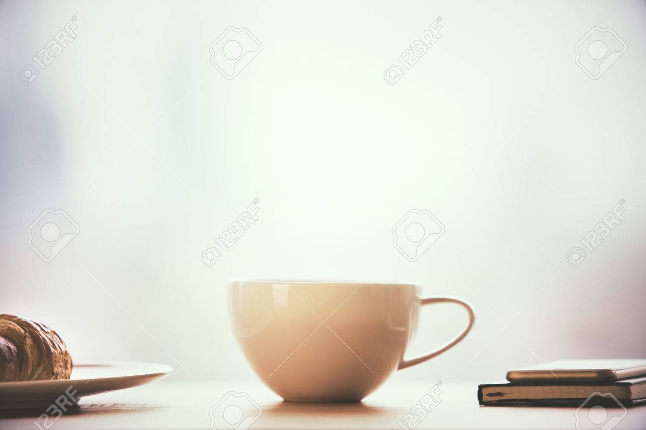 Closeup Of Round Coffee Mug On Table With Croissant Notepad Stock Photo Picture And Royalty Free Image Image 56034251