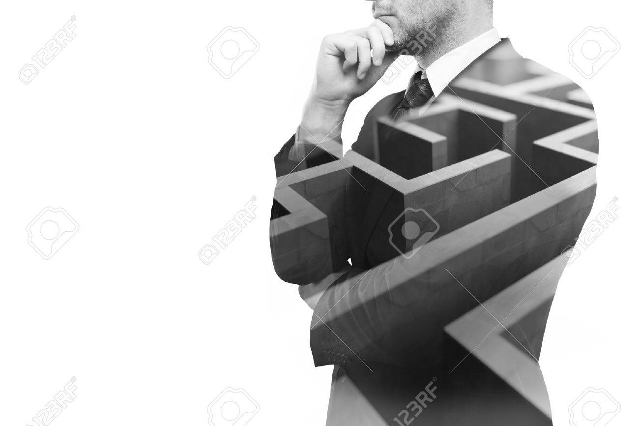 Young businessperson thinking about ways to overcome business obstacle. Isolated on white background with maze and copy space. Double exposure - 59959423 Young businessperson thinking about ways to overcome business obstacle. Isolated on white background with maze and copy space. Double exposure - 59959423