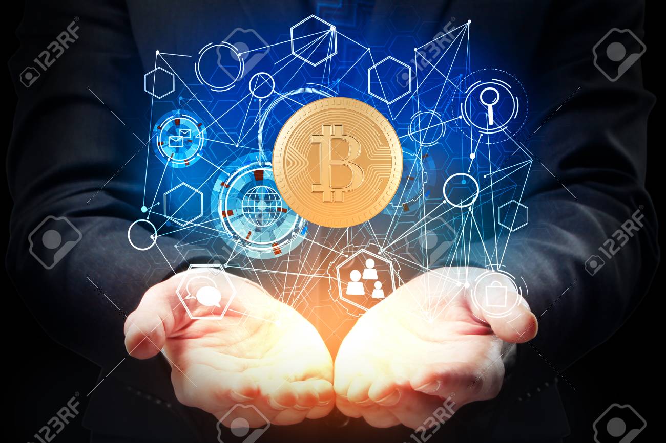 Businessman Hands Holding Abstract Bitcoin Hologram On Dark Background.  Cryptocurrency Concept Stock Photo, Picture and Royalty Free Image. Image  85047682.