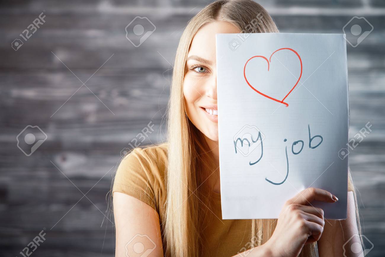 Attractive young woman with love my job text on wooden background. Success and occupation concept - 91523962 Attractive young woman with love my job text on wooden background. Success and occupation concept - 91523962