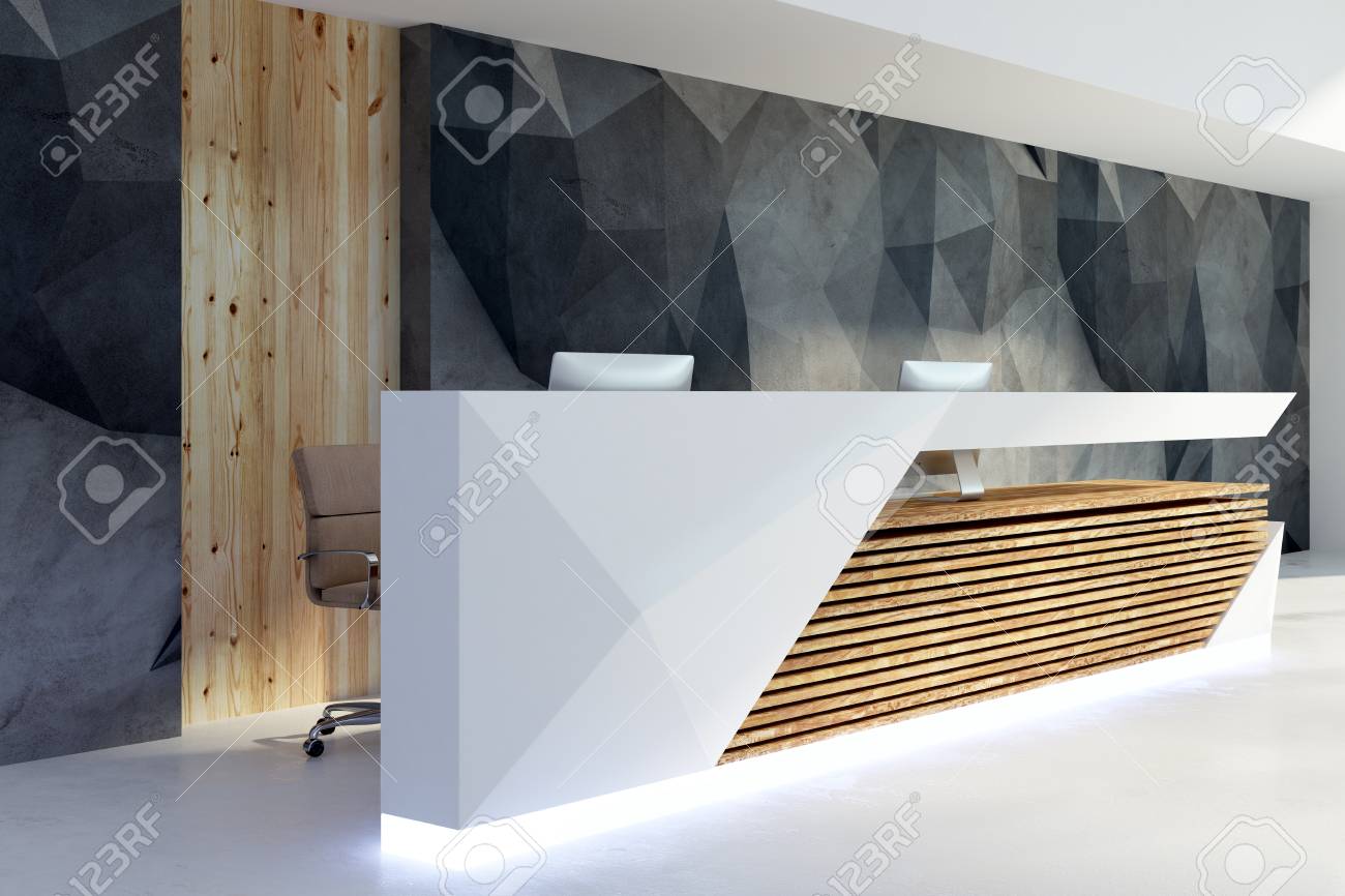 Side View Of Illuminated Reception Desk In Clean Office Interior