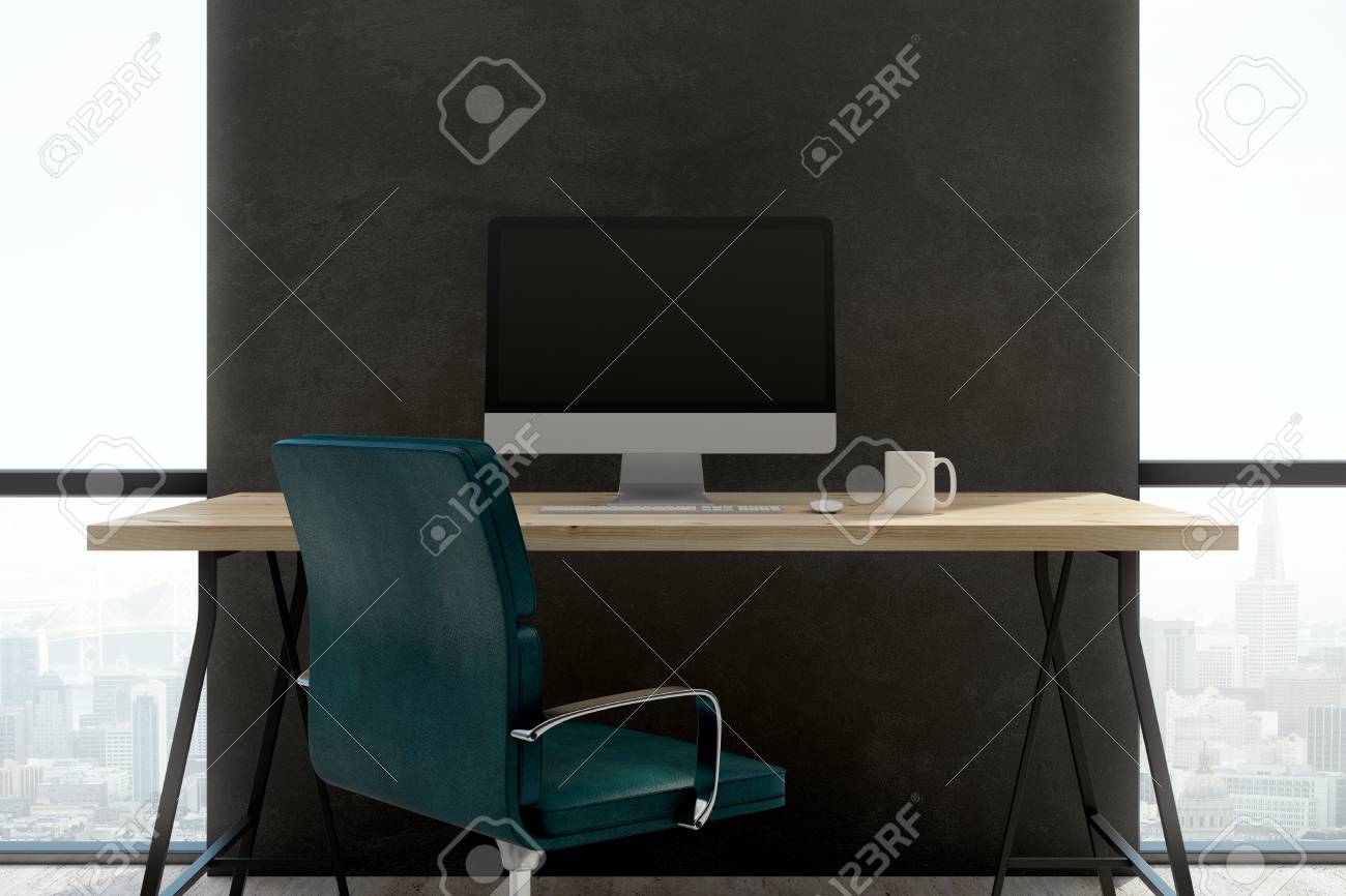 Dark Concrete Office Interior With Empty Computer Screen On Wooden