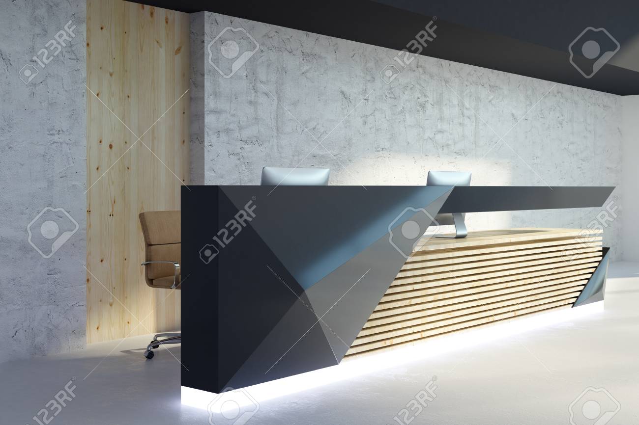 Side View Of Illuminated Reception Desk In Modern Office Interior