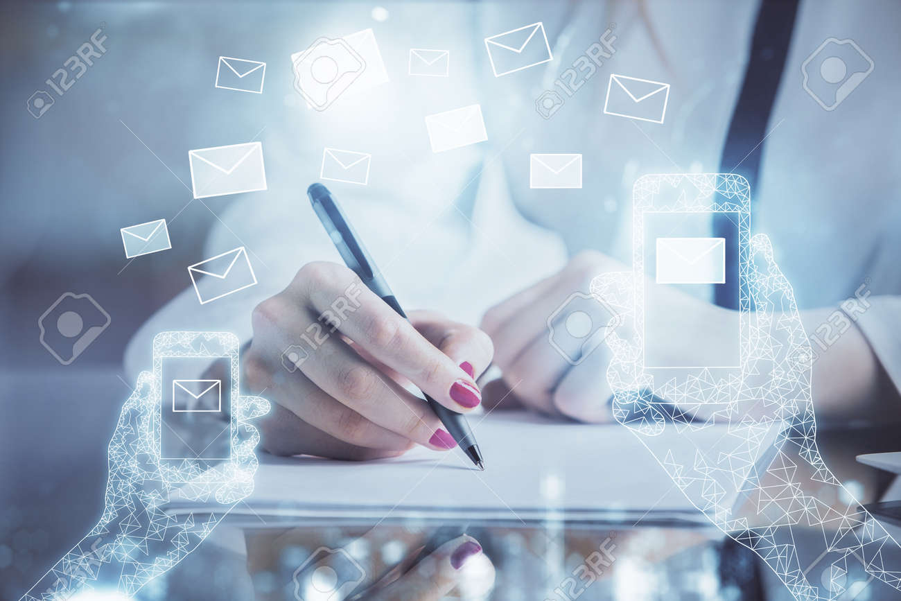 E-mail envelop theme hologram over hands taking notes background. Concept of electronic mail. Double exposure - 156018610 E-mail envelop theme hologram over hands taking notes background. Concept of electronic mail. Double exposure - 156018610