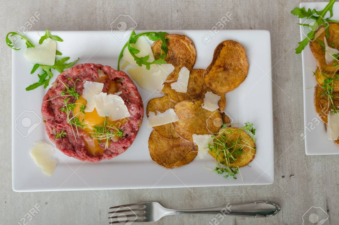 Beef Tartar Homemade Potato Chips Sprinkled With Parmesan Shavings Stock Photo Picture And Royalty Free Image Image 38132328