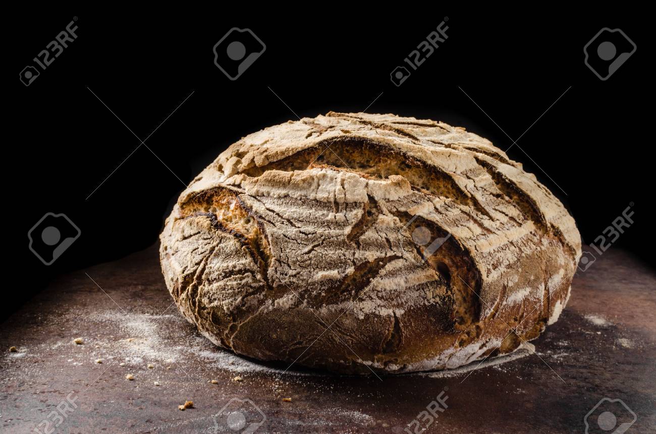 Homemade bread sourdough, rustic baked bread in wickerwork basket - 57348931 Homemade bread sourdough, rustic baked bread in wickerwork basket - 57348931