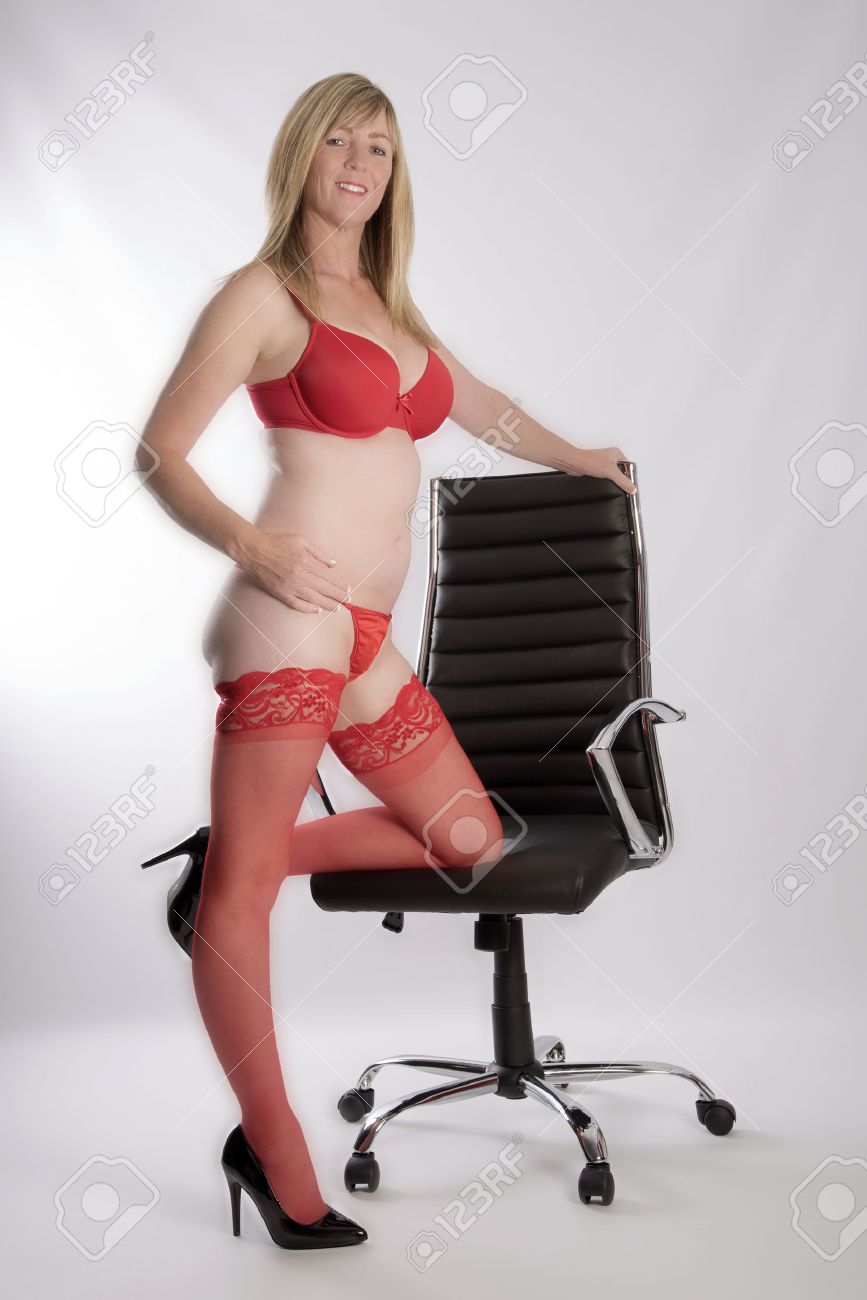 Blond Secretary Wearing Red Underwear With An Executive Office Chair Stock  Photo, Picture and Royalty Free Image. Image 69798379.