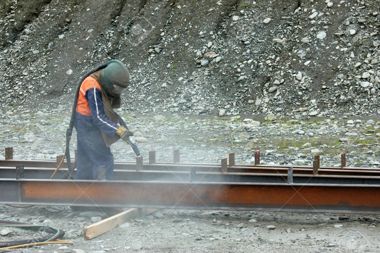 tradesman sandblasting beams for building project - 23339172 tradesman sandblasting beams for building project - 23339172