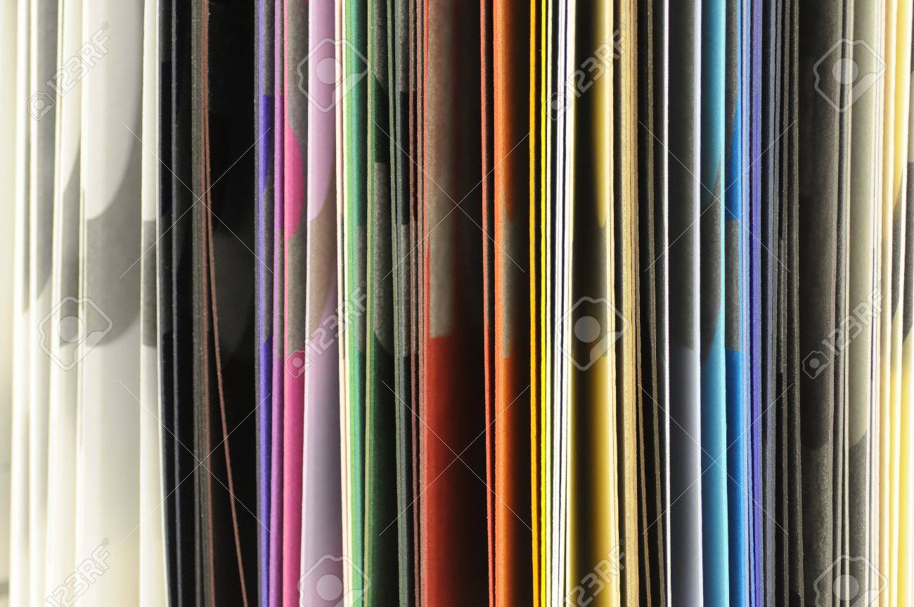 edges of coloured paper samples in a swatch book stock photo