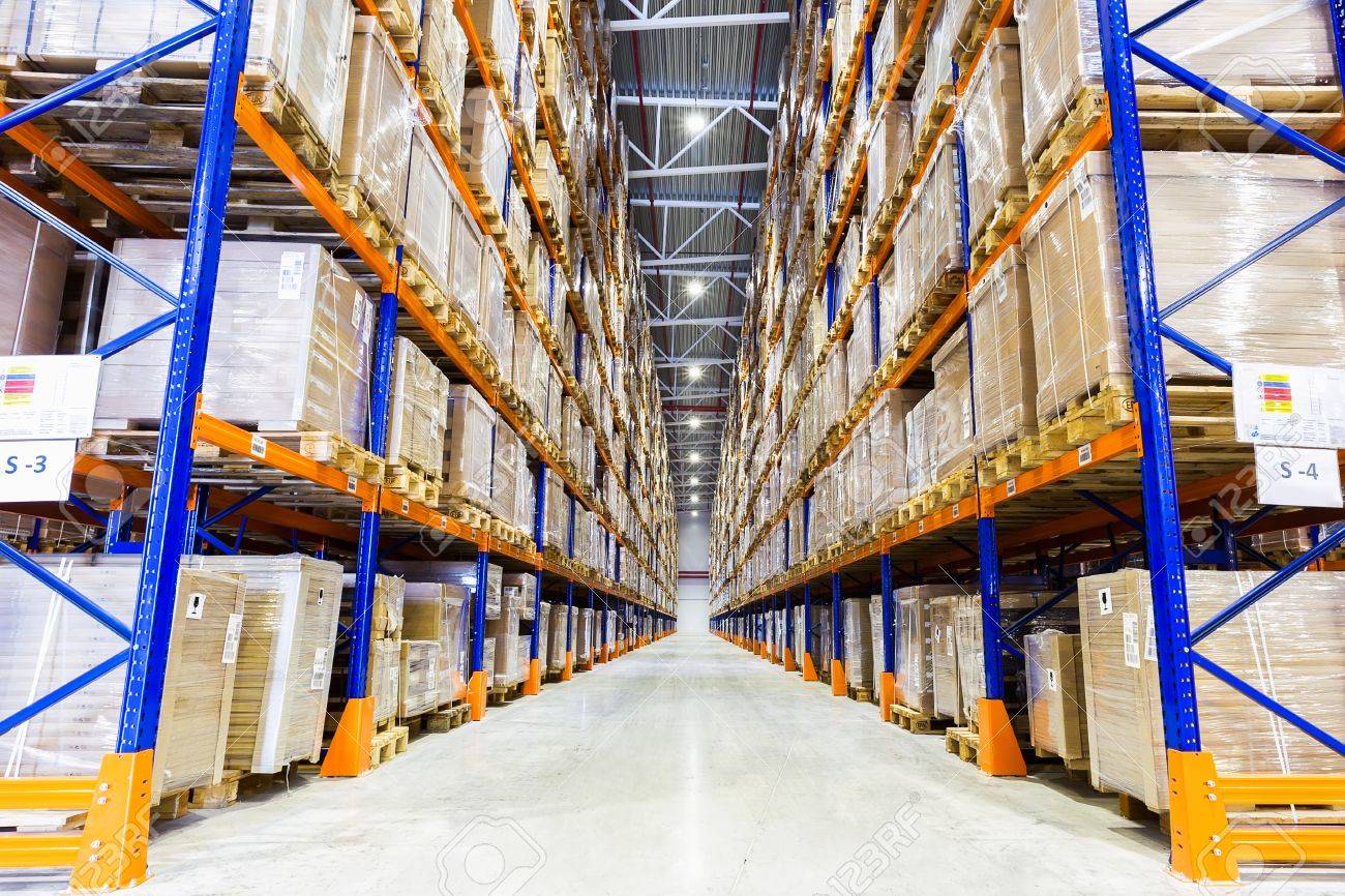rows of shelves with boxes in modern warehouse stock photo picture
