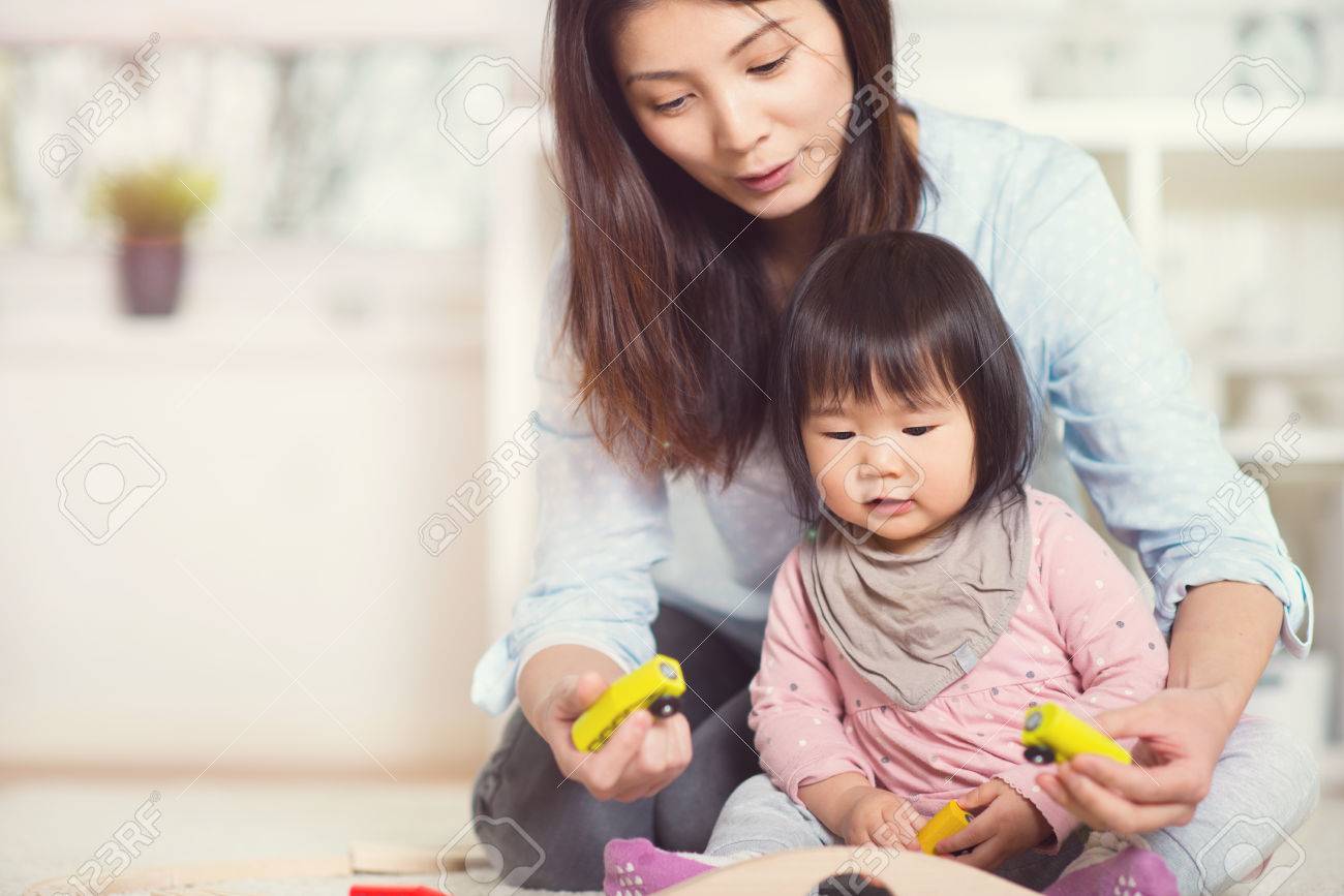 Pretty Happy Japanese Mother Play With picture