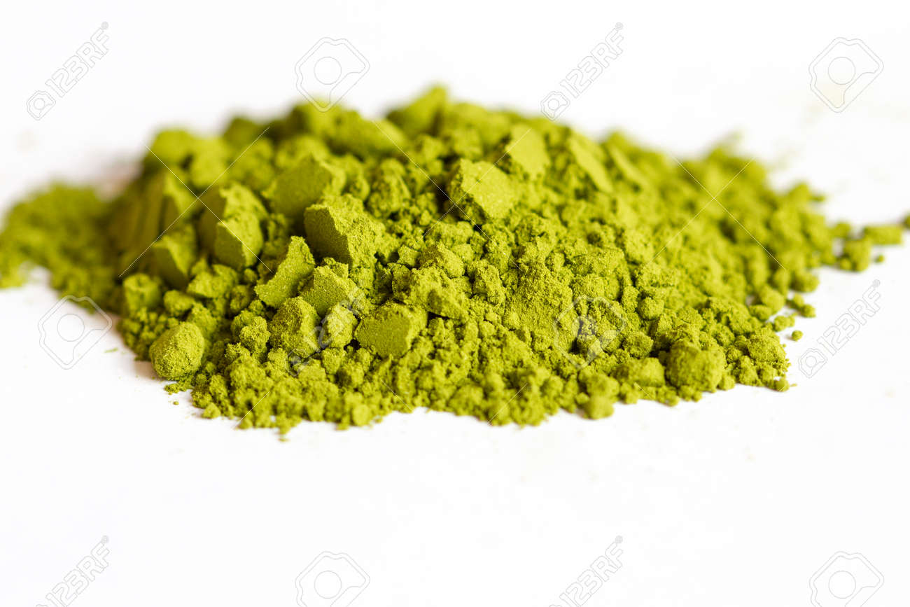 Powdered green matcha tea on a white isolated background close-up. Texture of matcha tea macro background. Copy space. Top view. - 170430052 Powdered green matcha tea on a white isolated background close-up. Texture of matcha tea macro background. Copy space. Top view. - 170430052