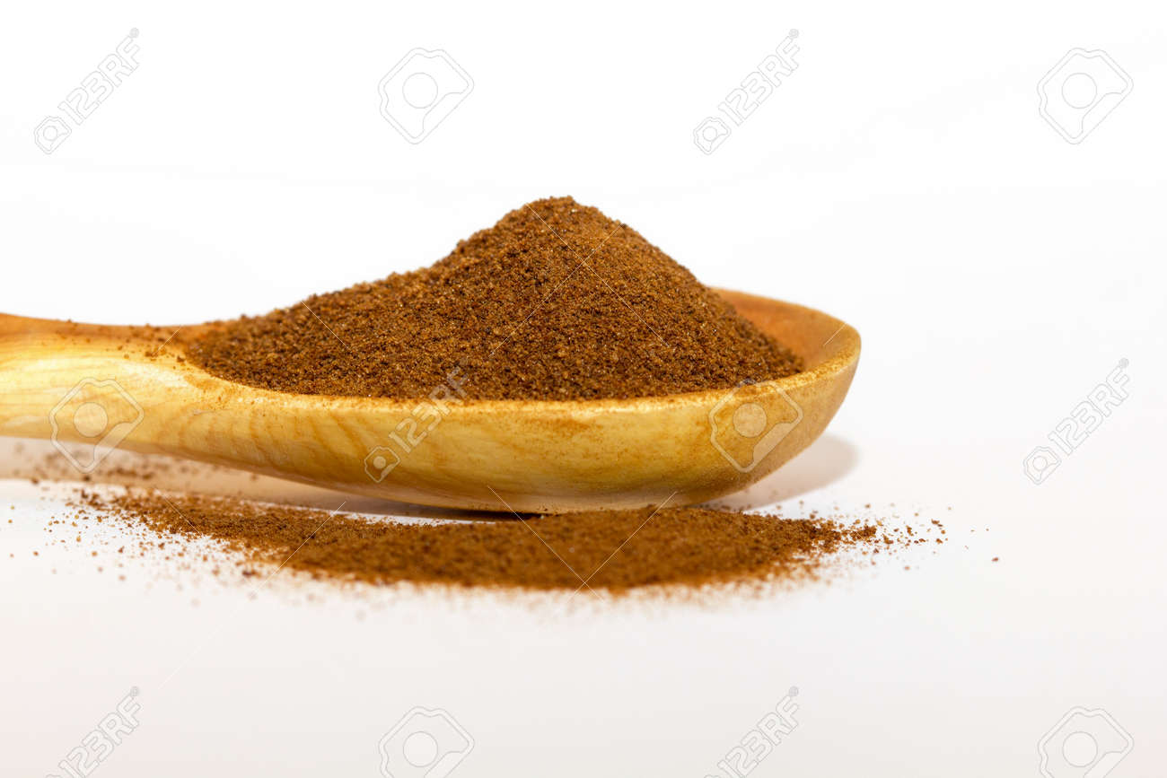 Instant chicory in a wooden spoon on a white background close-up. Isolate. Macro of chicory.side view - 170430082 Instant chicory in a wooden spoon on a white background close-up. Isolate. Macro of chicory.side view - 170430082