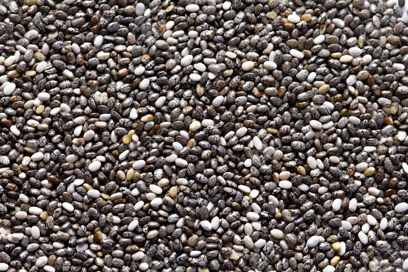 Chia seeds close-up background macro. The texture of the Chia seeds. Copy space. Flat lay. Healthy food from Chia seeds. - 170430155 Chia seeds close-up background macro. The texture of the Chia seeds. Copy space. Flat lay. Healthy food from Chia seeds. - 170430155