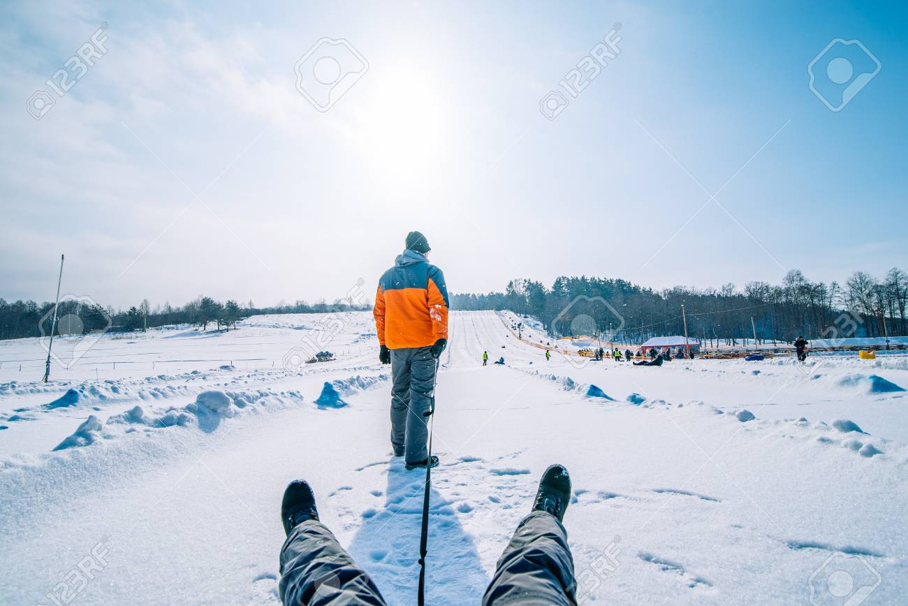 man pulling sleigh with
