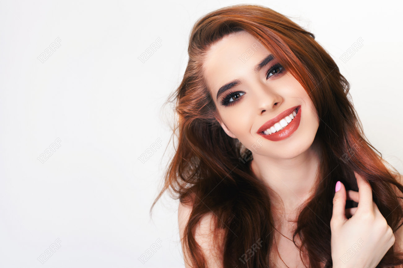 Pretty young woman with healthy perfect hair and white smile. Crowns tooth, teeth. Hair. Beauty. Hairstyle. Shampoo and natural herbal balsam. - 55144176 Pretty young woman with healthy perfect hair and white smile. Crowns tooth, teeth. Hair. Beauty. Hairstyle. Shampoo and natural herbal balsam. - 55144176