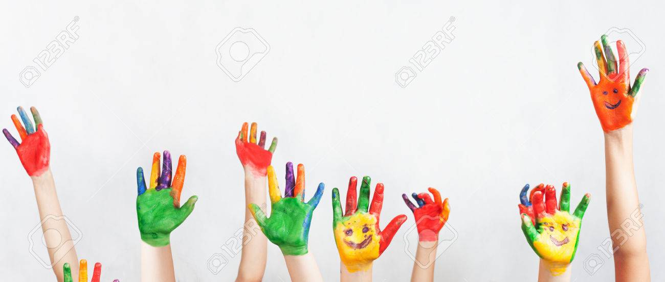 lot of painted hands raised up group of multiracial funny children