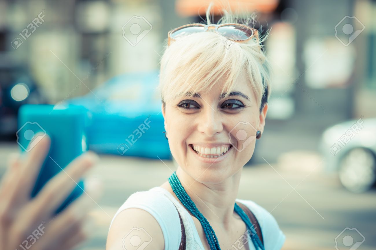 Beautiful Young Blonde Short Hair Hipster Woman Selfie In The