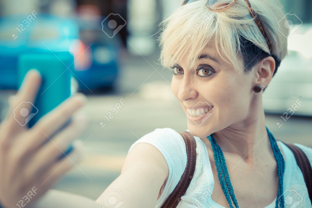 Beautiful Young Blonde Short Hair Hipster Woman Selfie In The