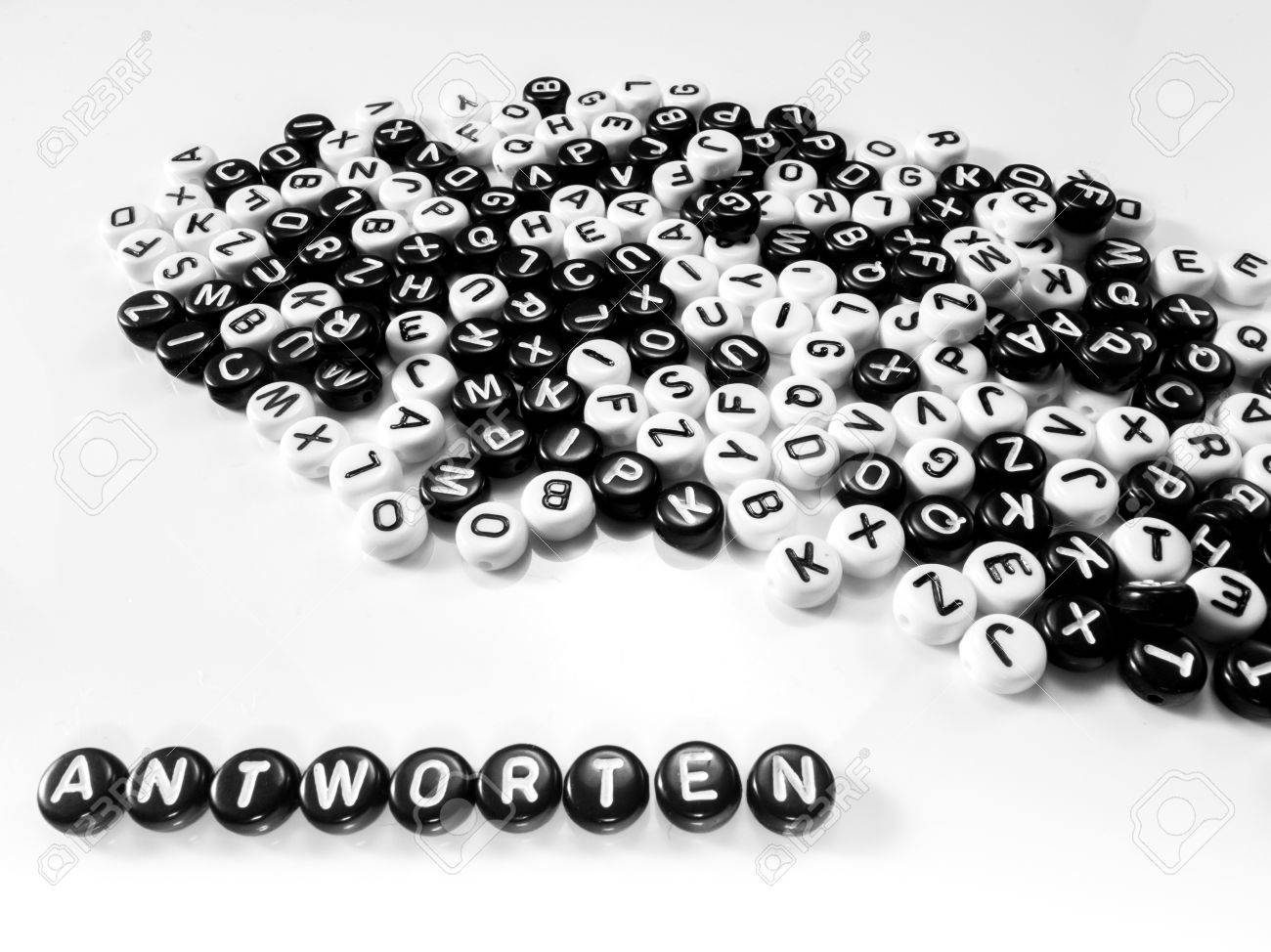heap of round letters black and white and answers word written in german; antworten - 55371366 heap of round letters black and white and answers word written in german; antworten - 55371366
