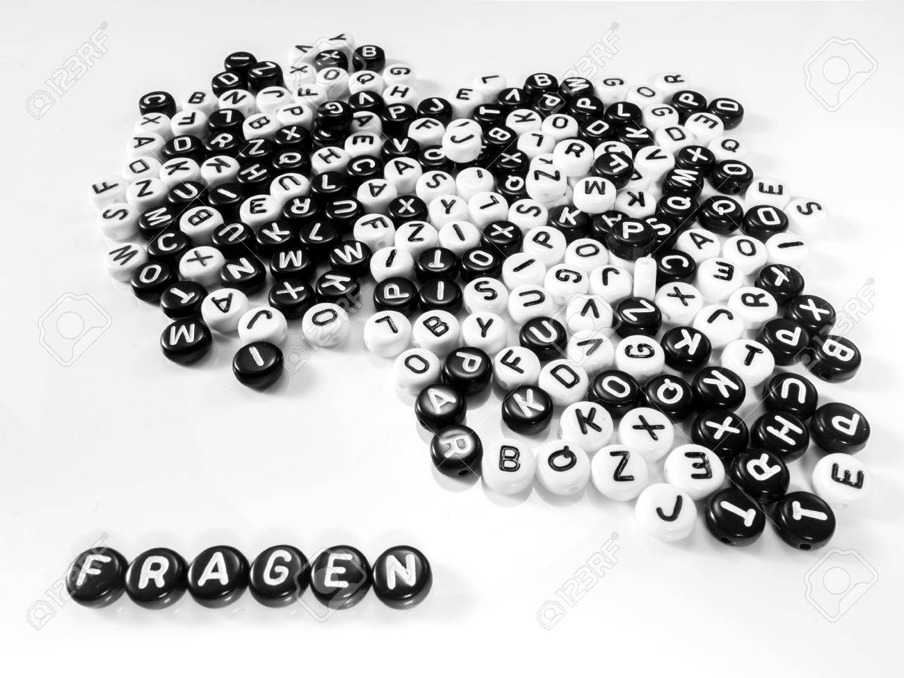 heap of round letters black and white and quotes word written in question written by side; fragen - 55371369 heap of round letters black and white and quotes word written in question written by side; fragen - 55371369